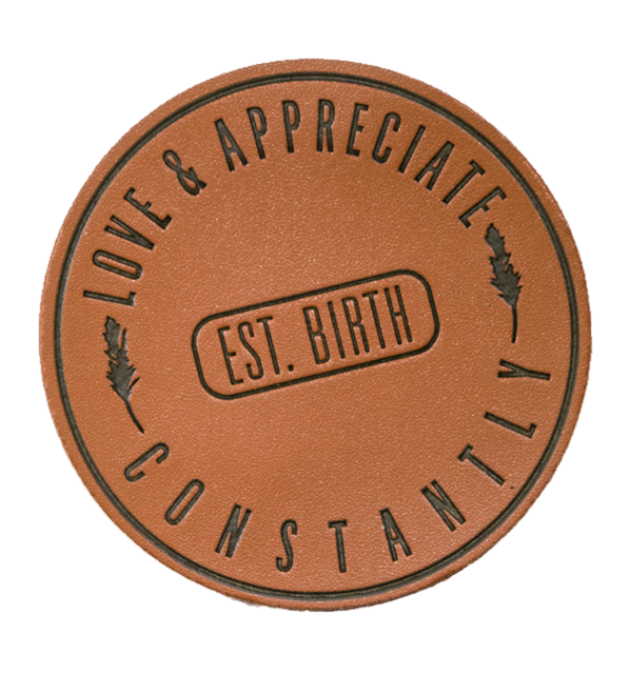 Stylish faux leather patch with engraved text for a classic and rustic look.