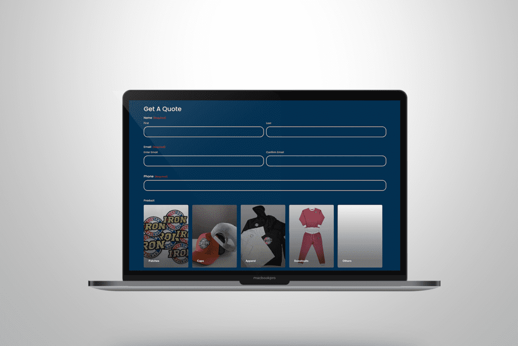 Custom iron-on patches being heat pressed onto fabric in a production setup