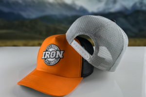 Custom Trucker Hat with Iron Patch on a Rock – Stylish and Durable.